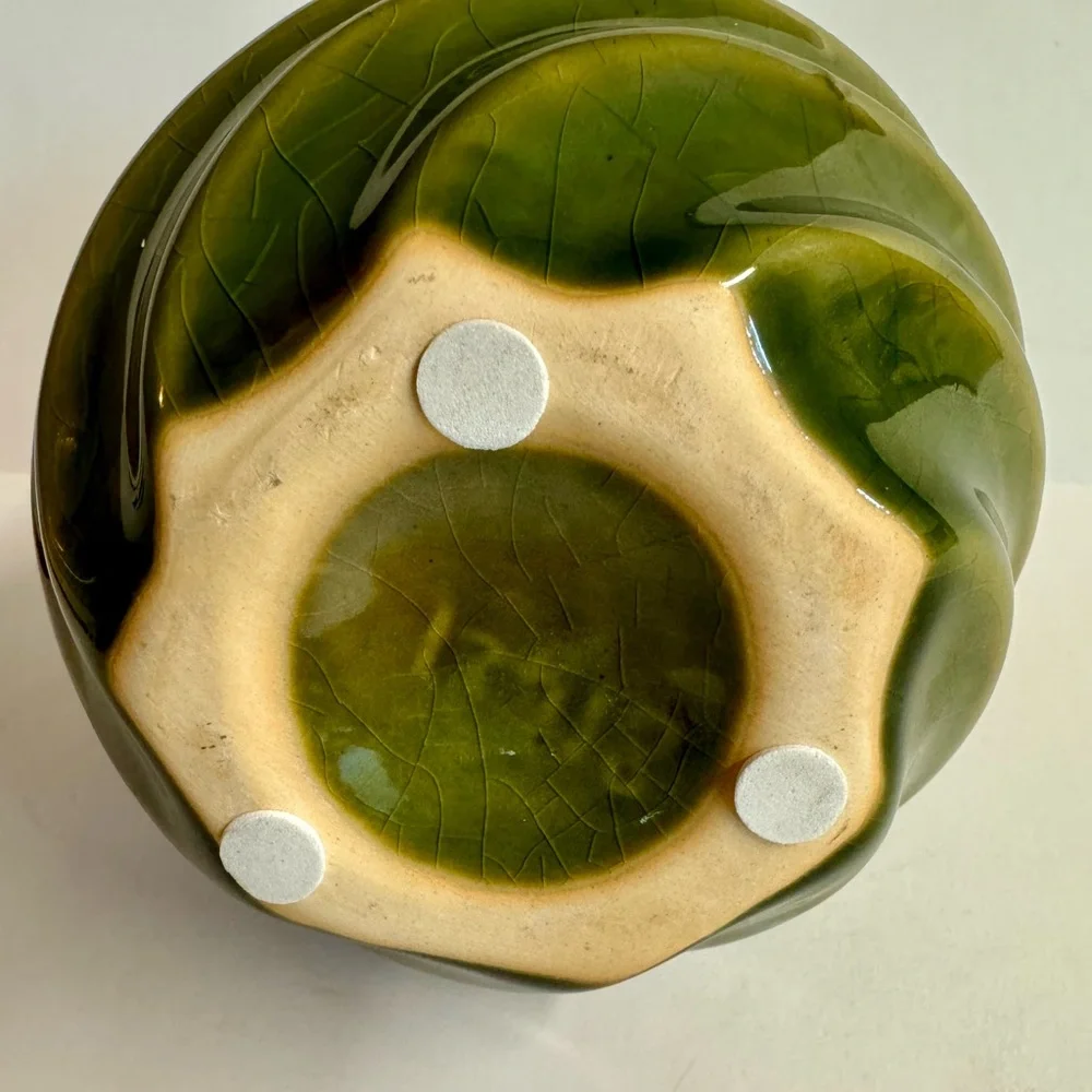 Vintage MCM pottery in earthy sage green  swirl vase.Has crazing.
